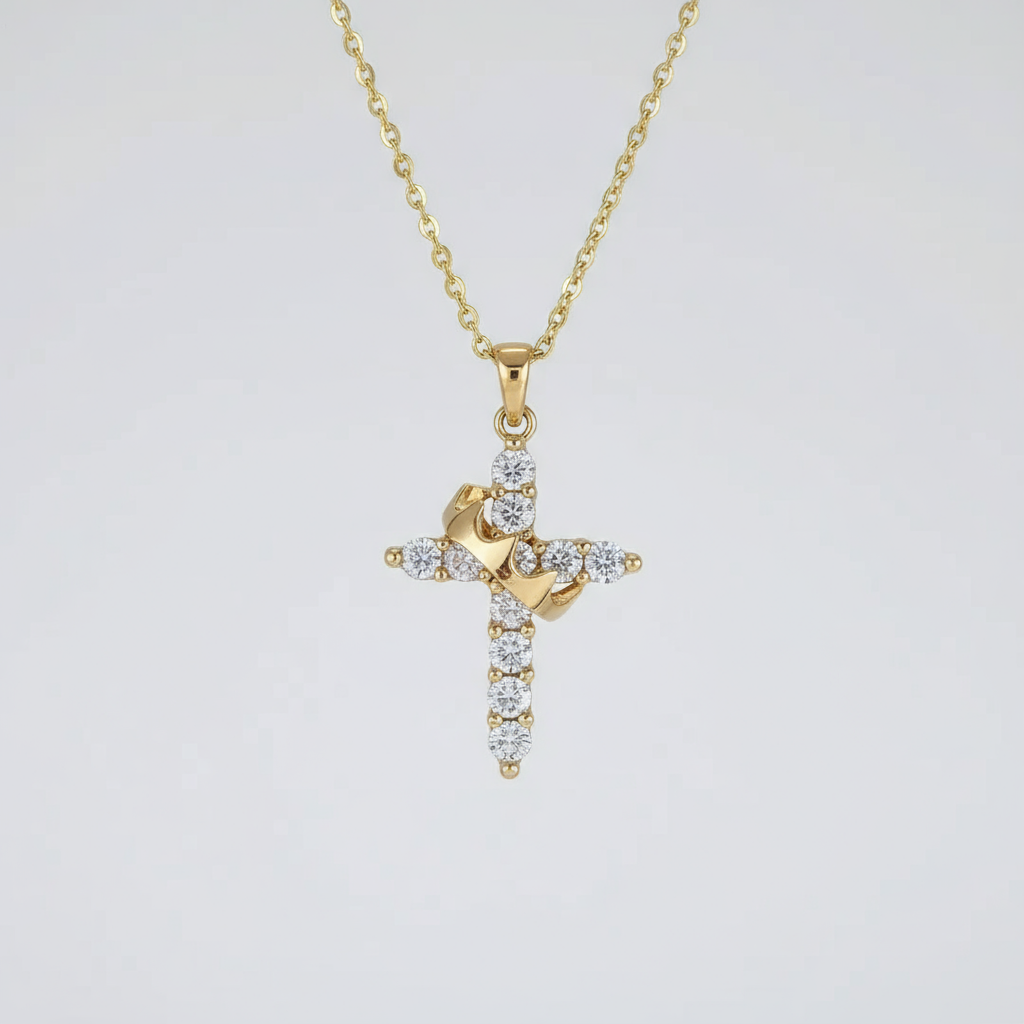 Gold cross necklace with diamonds on a light gray background