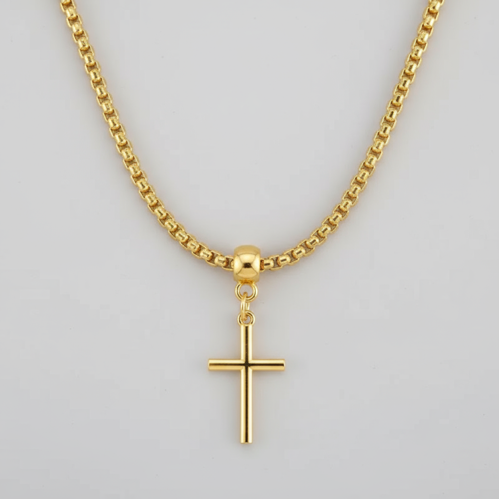 Gold necklace with a cross pendant on a white background