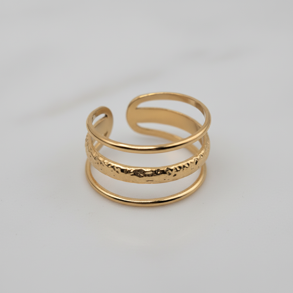 wholesale Gold open ring on a light background